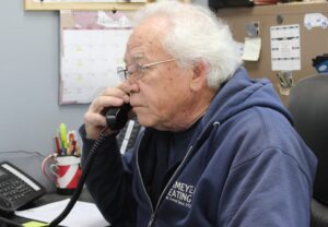 Image of Mark Eickmeyer, president of Eickmeyer Heating, using a phone. Contact us anytime.